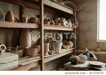 Image of different ceramic vases on the shelves in the workshop 85316570