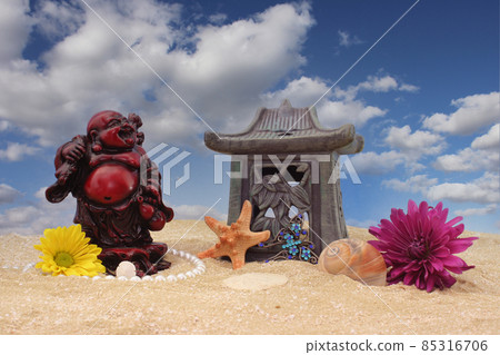Flowers with Sea Shells and Buddha on Sand With Blue Sky Background Flowers with Sea Shells and Buddha on Sand With Blue Sky Background 85316706