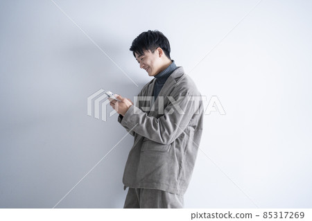 A man using a smartphone A man using a smartphone 85317269