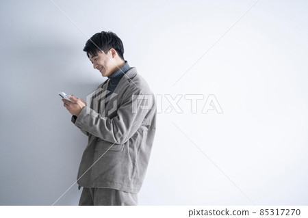 A man using a smartphone A man using a smartphone 85317270