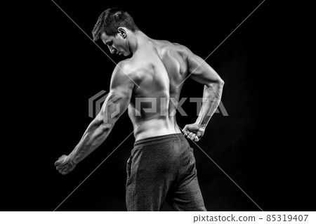 Image of very muscular man posing with naked torso 85319407