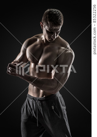 Sporty healthy man posing and showing his perfect boddy 85322256