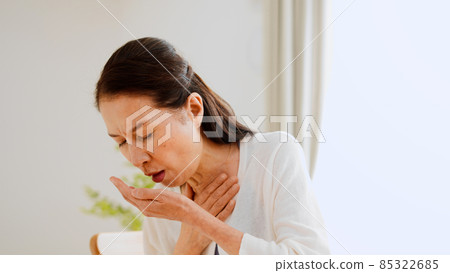 Senior female coughing Senior female coughing 85322685