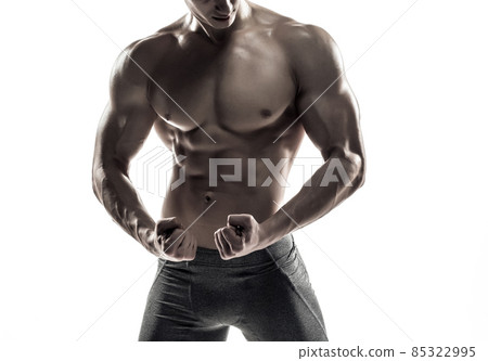 Bodybuilder man posing, showing perfect abs, houlders, biceps, triceps, chest Bodybuilder man posing, showing perfect abs, houlders, biceps, triceps, chest 85322995