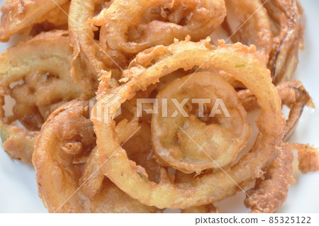 batter fried onion ring on plate dipping chili sweet sauce batter fried onion ring on plate dipping chili sweet sauce 85325122