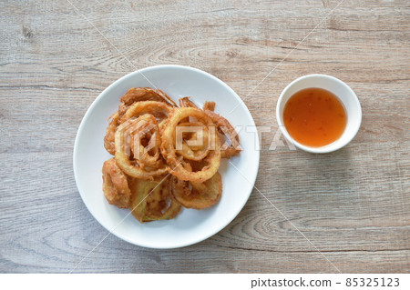 batter fried onion ring on plate dipping chili sweet sauce batter fried onion ring on plate dipping chili sweet sauce 85325123