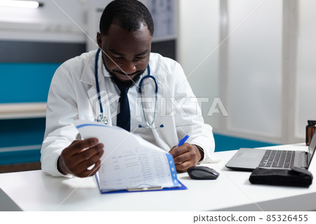 African american therapist doctor checking medicine prescription documents African american therapist doctor checking medicine prescription documents 85326455