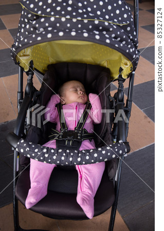 Portrait of Asian baby in the stroller Portrait of Asian baby in the stroller 85327124
