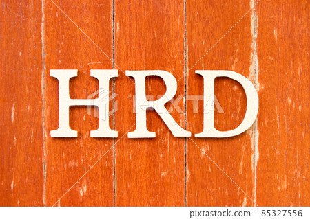 Alphabet letter in word  HRD (Abbreviation of human resource development) on old red color wood plate background 85327556