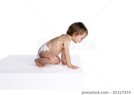Portrait of little boy, baby, child in diaper isolated over white studio background. Childhood concept 85327974