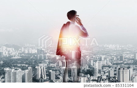 Concept of business success and control with confident boss against cityscape background 85331104