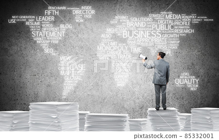 Businessman standing with megaphone. 85332001