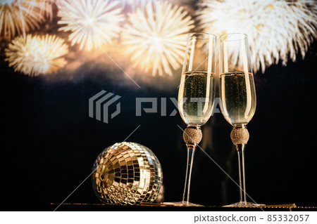 happy New Year champagne glasses and fireworks celebration background 85332057