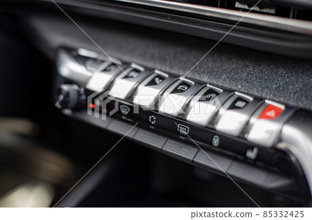 multimedia control console and climate in a modern car. close-up, selective focus, no people multimedia control console and climate in a modern car. close-up, selective focus, no people 85332425