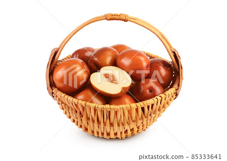 jujube or chinese date in wicker basket isolated on white background with clipping path and full depth of field 85333641
