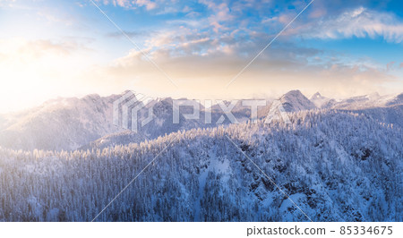 Aerial Panoramic View of Canadian Mountain covered in snow. 85334675