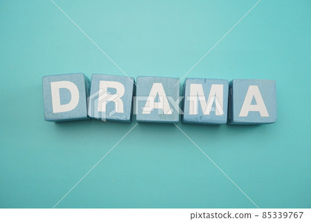 Drama word created with cubes alphabet letters on blue background 85339767