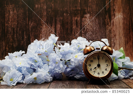 Vintage Alarm Clock And Flower Bouquet with space copy on wooden background 85340025