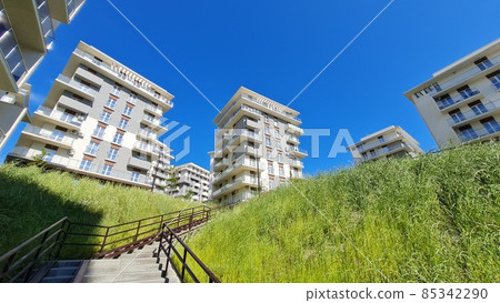 New high-rise buildings on a green hill New high-rise buildings on a green hill 85342290