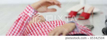 Woman lying on floor at home and fainting, health 85342504