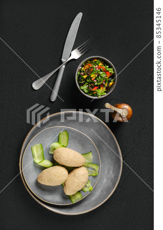 Top view of semifinished frozen cepelinai. Potato dumplings stuffed with ground meat 85345146