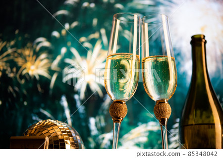 happy New Year champagne glasses and fireworks celebration background 85348042