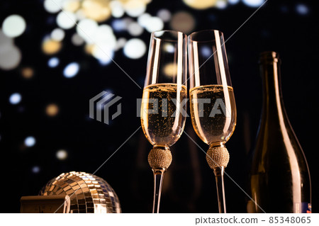happy New Year champagne glasses and fireworks celebration background 85348065
