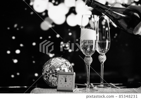 happy New Year champagne glasses and fireworks celebration background 85348231