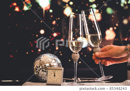 happy New Year champagne glasses and fireworks celebration background 85348243