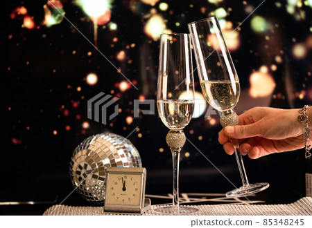 happy New Year champagne glasses and fireworks celebration background 85348245