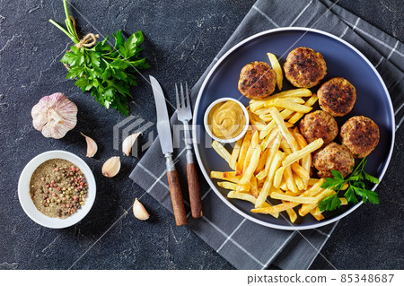 Vitoulet, hot Belgian meatballs with french fries 85348687