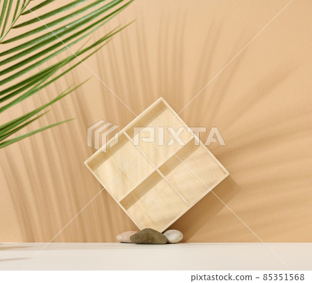 background to showcase products, cosmetics, drinks and food. Beige background with shade from palm leaf 85351568