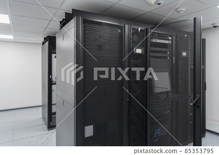 Data Center With Multiple Rows of Fully Operational Server Racks. Modern Telecommunications, Cloud Computing, Artificial Intelligence, Database, Supercomputer Technology Concept. Data Center With Multiple Rows of Fully Operational Server Racks. Modern Telecommunications, Cloud Computing, Artificial Intelligence, Database, Supercomputer Technology Concept. 85353795