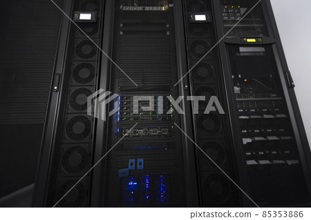 Data Center With Multiple Rows of Fully Operational Server Racks. Modern Telecommunications, Cloud Computing, Artificial Intelligence, Database, Supercomputer Technology Concept. Data Center With Multiple Rows of Fully Operational Server Racks. Modern Telecommunications, Cloud Computing, Artificial Intelligence, Database, Supercomputer Technology Concept. 85353886