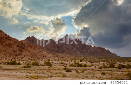 Aerial view rock mountains in the high desert in the middle of the highway of Arizona Aerial view rock mountains in the high desert in the middle of the highway of Arizona 85354951