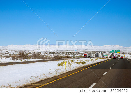 Aerial view desert after snowstorm of Interstate 17 near Flagstaff, Arizona Aerial view desert after snowstorm of Interstate 17 near Flagstaff, Arizona 85354952
