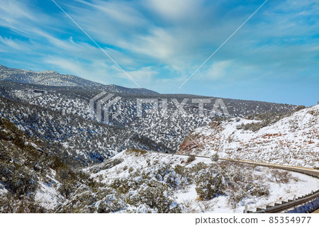 Snowy mountain panorama view in Arizona winter with snow clear blue sky Snowy mountain panorama view in Arizona winter with snow clear blue sky 85354977
