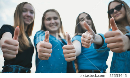 A group of girls girlfriends show thumbs up. A group of girls girlfriends show thumbs up. 85355643