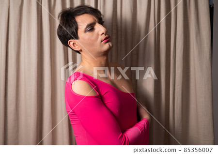 Homosexual in a pink female dress. A man in make-up. Homosexual in a pink female dress. A man in make-up. 85356007