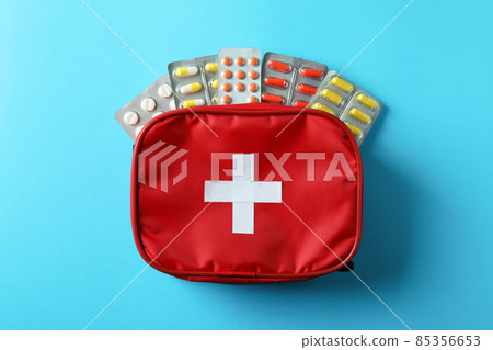 First aid medical kit on blue background 85356653