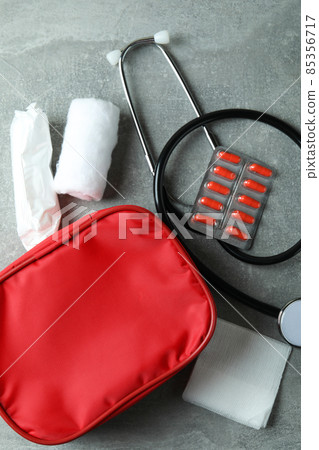 First aid medical kit on gray textured table First aid medical kit on gray textured table 85356717