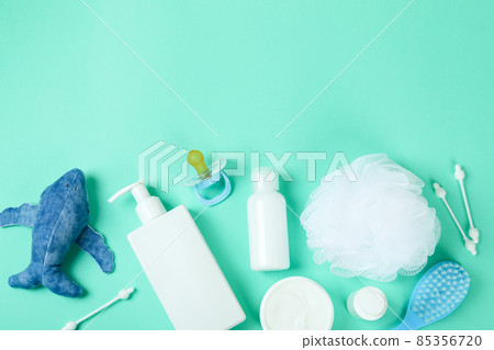 Different baby hygiene accessories on mint background Different baby hygiene accessories on mint background 85356720