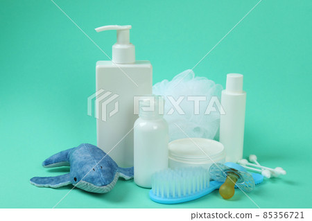 Different baby hygiene accessories on mint background 85356721