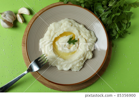 Concept of tasty eating with mashed potatoes on green background 85356900