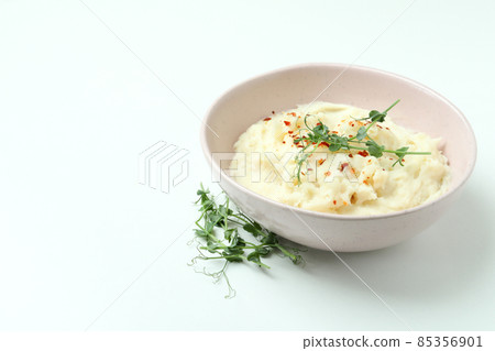 Plate of mashed potatoes on white background 85356901