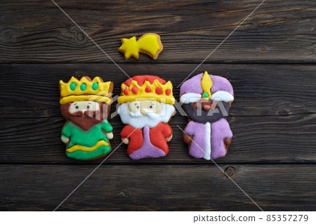 Happy Epiiphany day. Homemade cookies in the shape of the three wise men on wooden background. Happy Epiiphany day. Homemade cookies in the shape of the three wise men on wooden background. 85357279