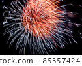 Flash of red and white fireworks on background black sky. Holiday concept. Close-up 85357424