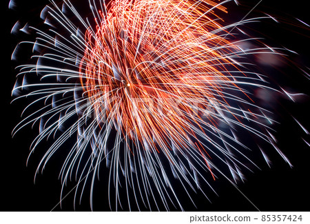 Flash of red and white fireworks on background black sky. Holiday concept. Close-up Flash of red and white fireworks on background black sky. Holiday concept. Close-up 85357424