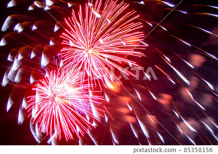 Red and white fireworks on background of night sky, close-up. Concept of holiday. Red and white fireworks on background of night sky, close-up. Concept of holiday. 85358156