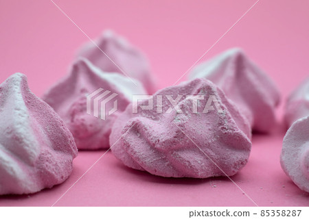 Closeup of meringues on pink background 85358287